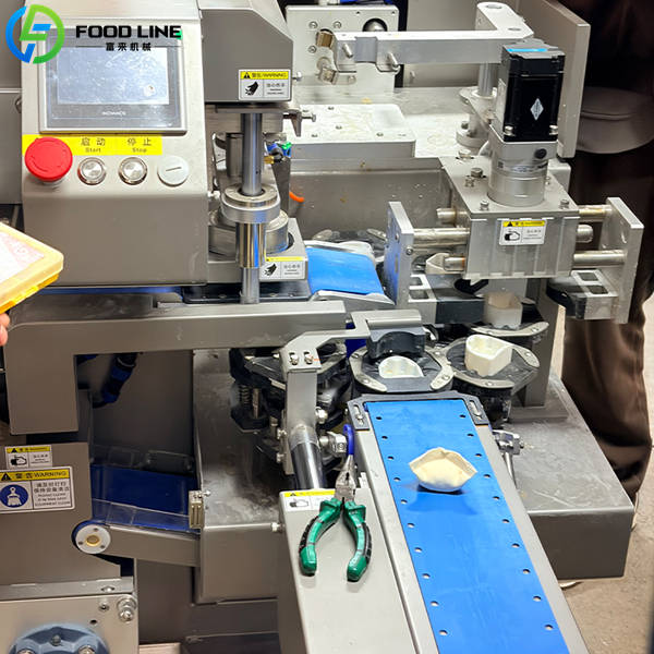 dumpling machine working